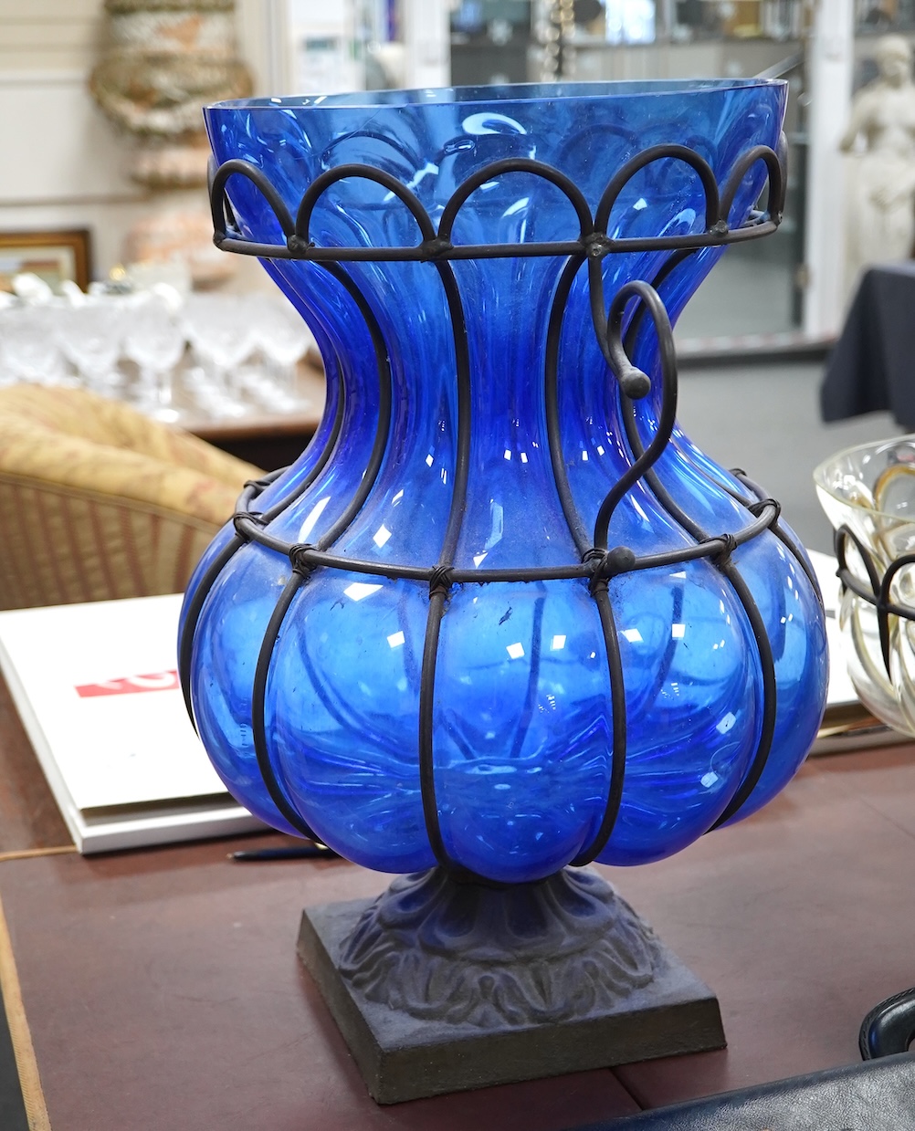 A wrought and cast iron mounted large blue glass vase, 49cm. Condition - would benefit from a clean, otherwise good